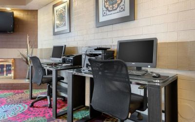 Business center with computers, printer and ergonomic chairs at Holiday Inn Express Chicago - Downers Grove.