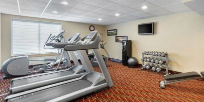 Well equipped fitness center at Holiday Inn Express Chicago - Downers Grove.