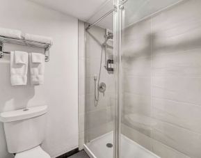 Private guest bathroom with shower at Radisson Hotel Schaumburg.