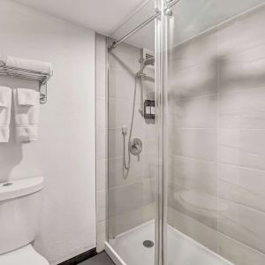 Private guest bathroom with shower at Radisson Hotel Schaumburg.