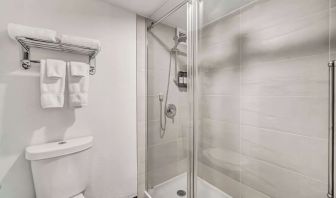 Private guest bathroom with shower at Radisson Hotel Schaumburg.