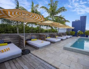 Outdoor pool with lounge beds at Catalina Hotel & Beach Club.