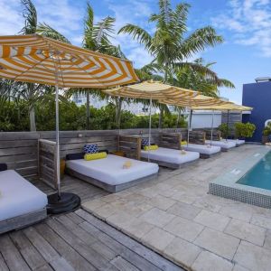Outdoor pool with lounge beds at Catalina Hotel & Beach Club.