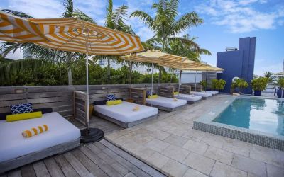 Outdoor pool with lounge beds at Catalina Hotel & Beach Club.