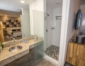 Private guest bathroom with shower and free toiletries at Catalina Hotel & Beach Club.