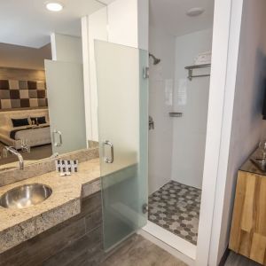 Private guest bathroom with shower and free toiletries at Catalina Hotel & Beach Club.