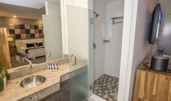 Private guest bathroom with shower and free toiletries at Catalina Hotel & Beach Club.