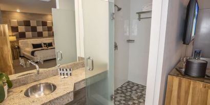 Private guest bathroom with shower and free toiletries at Catalina Hotel & Beach Club.