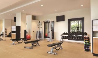 Fully equipped fitness center at Hilton Boston Logan Airport.