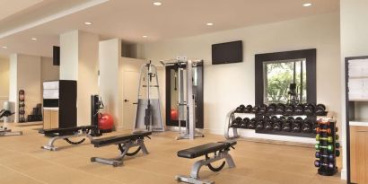 Fully equipped fitness center at Hilton Boston Logan Airport.