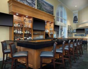 On-site bar and lounge area at Hilton Indianapolis Hotel & Suites.