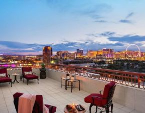 Rooftop terrace with lounge seating at Embassy Suites By Hilton Convention Center Las Vegas.
