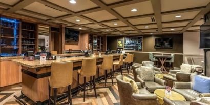 Dining area with lounge seating at Hilton Baton Rouge Capitol Center.