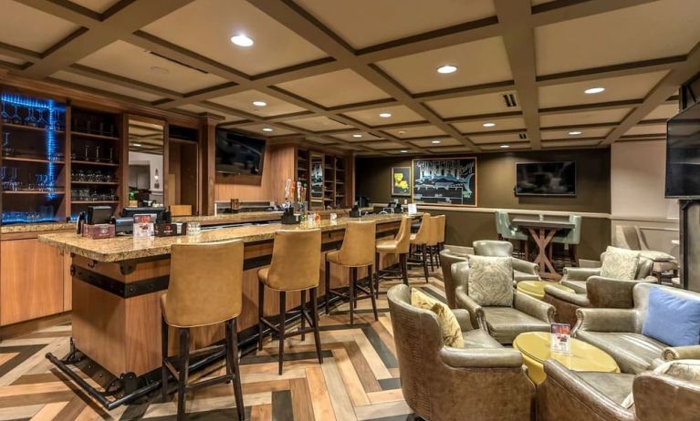 Dining area with lounge seating at Hilton Baton Rouge Capitol Center.