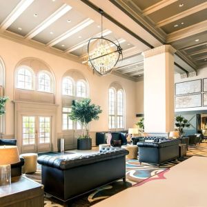 Hotel lobby with comfortable seating and workspace, perfect for coworking at Hilton Baton Rouge Capitol Center.