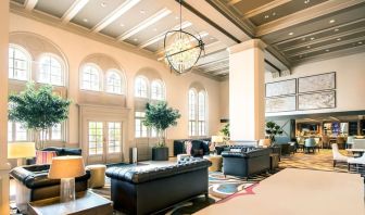 Hotel lobby with comfortable seating and workspace, perfect for coworking at Hilton Baton Rouge Capitol Center.