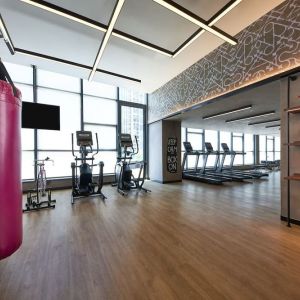 Fitness center with natural light at Moxy Boston Downtown.