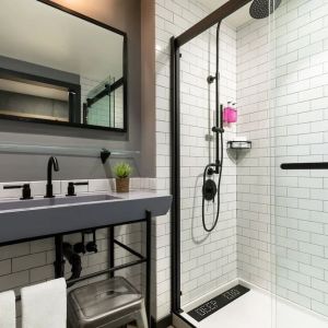 Private guest bathroom with shower at Moxy Boston Downtown.