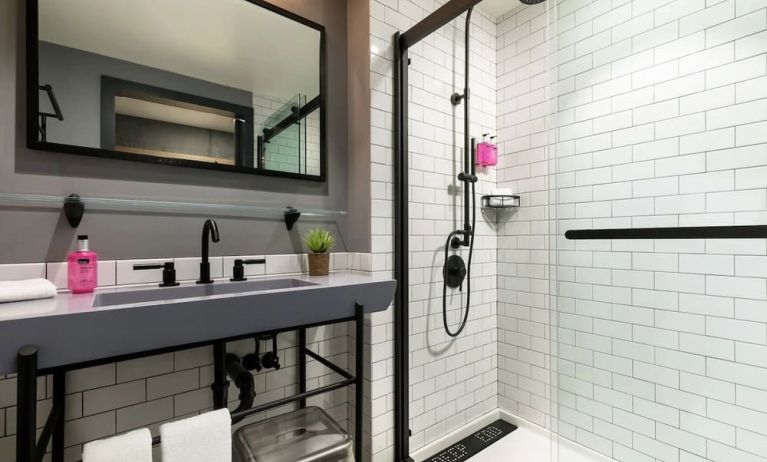 Private guest bathroom with shower at Moxy Boston Downtown.