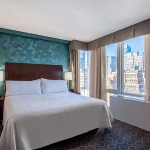 King bedroom with city views at Hilton Garden Inn New York/West 35th Street.

