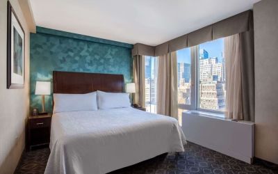 King bedroom with city views at Hilton Garden Inn New York/West 35th Street.