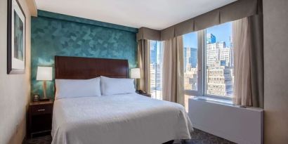 King bedroom with city views at Hilton Garden Inn New York/West 35th Street.
