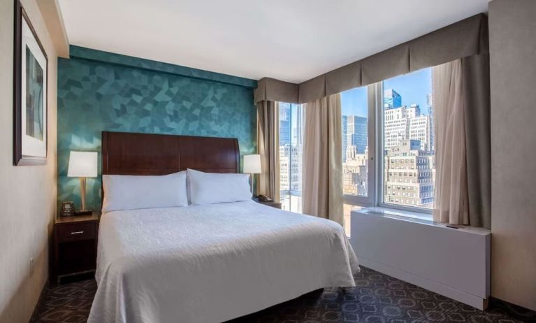 King bedroom with city views at Hilton Garden Inn New York/West 35th Street.
