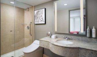 Private guest bathroom with shower at Hilton Garden Inn New York/West 35th Street.
