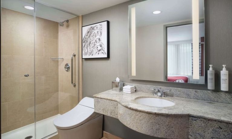 Private guest bathroom with shower at Hilton Garden Inn New York/West 35th Street.
