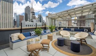 Rooftop coworking space with a view of the city at Hilton New York Fashion District.