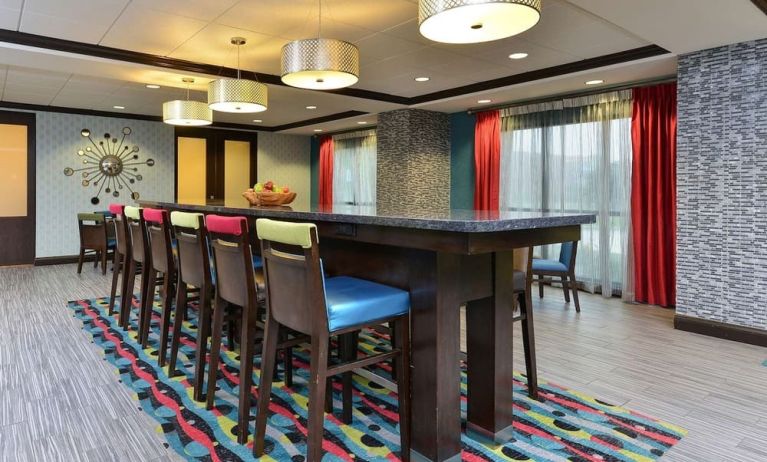 Dining area and workspace at Hampton Inn Iowa City/University Area.