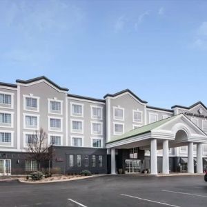 Exterior and parking area at Park Manor Hotel.