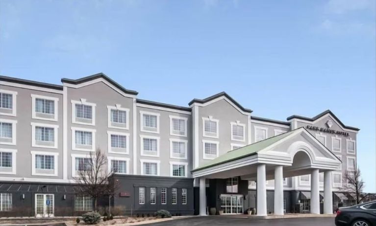 Exterior and parking area at Park Manor Hotel.