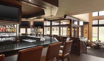 Hotel bar with lounge seating at DoubleTree By Hilton Hartford - Bradley Airport.