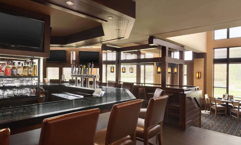Hotel bar with lounge seating at DoubleTree By Hilton Hartford - Bradley Airport.