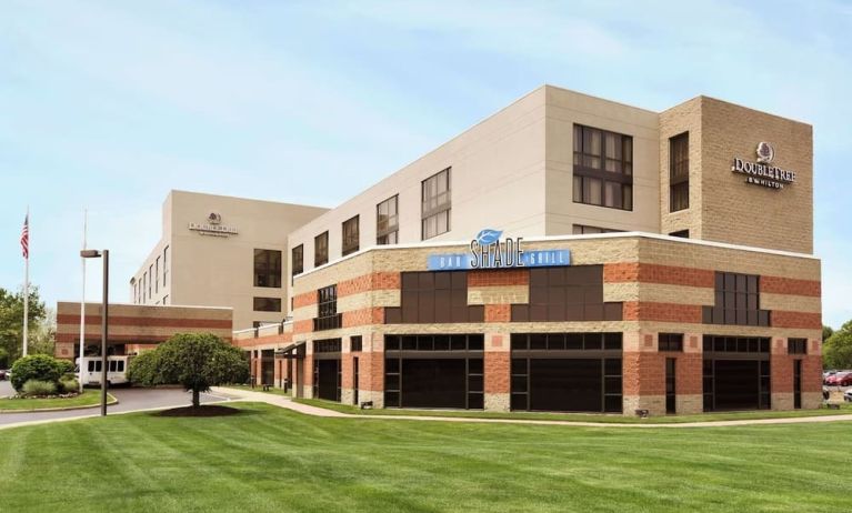 Hotel exterior and parking area at DoubleTree By Hilton Hartford - Bradley Airport.