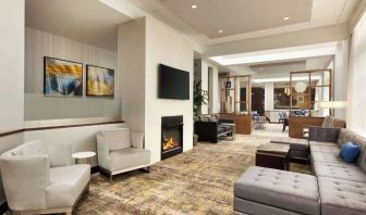 Lobby lounge area with fireplace at DoubleTree By Hilton Hartford - Bradley Airport.