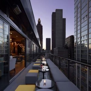 Hotel bar with balcony at Royalton Park Avenue.