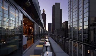 Hotel bar with balcony at Royalton Park Avenue.