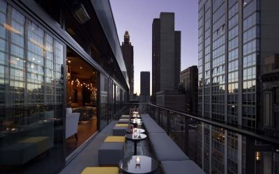 Hotel bar with balcony at Royalton Park Avenue.