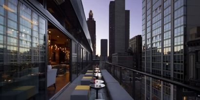 Hotel bar with balcony at Royalton Park Avenue.