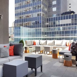 Terrace with ample seats perfect for coworking at The Bernic Hotel New York City, Tapestry Collection By Hilton.