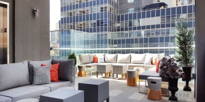 Terrace with ample seats perfect for coworking at The Bernic Hotel New York City, Tapestry Collection By Hilton.