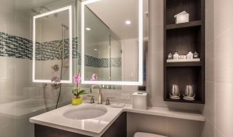 Guest bathroom with shower at The Bernic Hotel New York City, Tapestry Collection By Hilton.