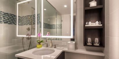 Guest bathroom with shower at The Bernic Hotel New York City, Tapestry Collection By Hilton.