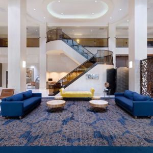 Lounge and coworking space at Embassy Suites By Hilton Santa Clara Silicon Valley.