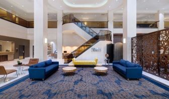 Lounge and coworking space at Embassy Suites By Hilton Santa Clara Silicon Valley.