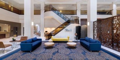 Lounge and coworking space at Embassy Suites By Hilton Santa Clara Silicon Valley.