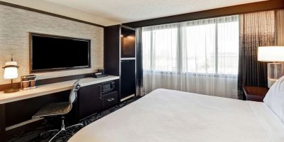 Day use room with work desk and natural light at Embassy Suites By Hilton Santa Clara Silicon Valley.