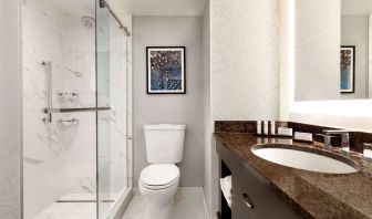 Private guest bathroom with shower at Embassy Suites By Hilton Santa Clara Silicon Valley.
